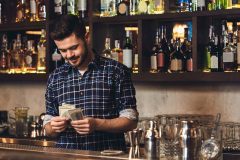 bartender counting money from tips