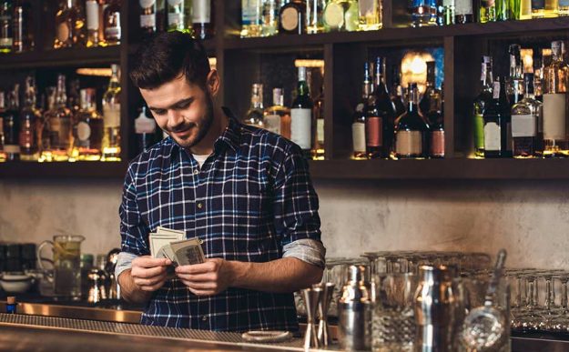 bartender counting money from tips