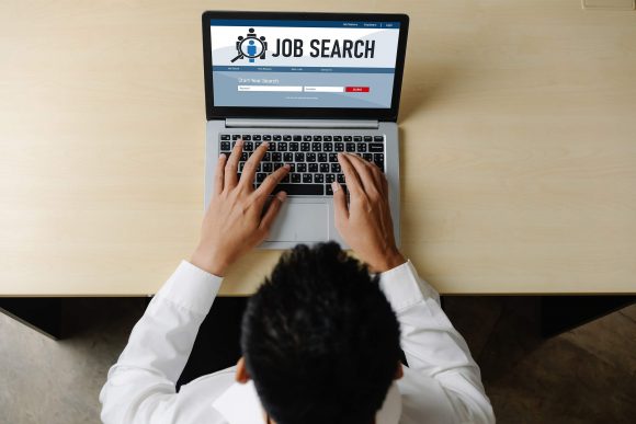 Searching for Jobs on Laptop