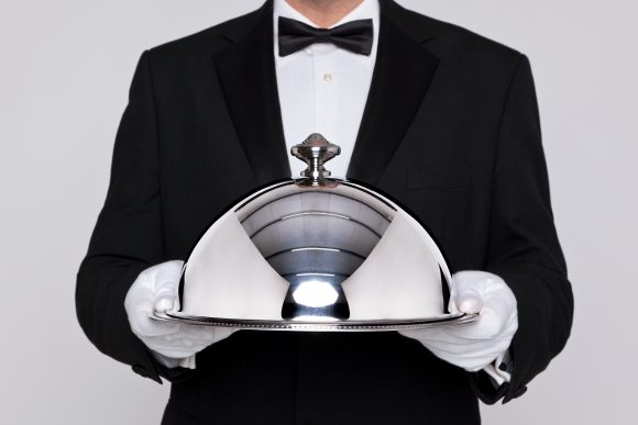 Waiter holding plate
