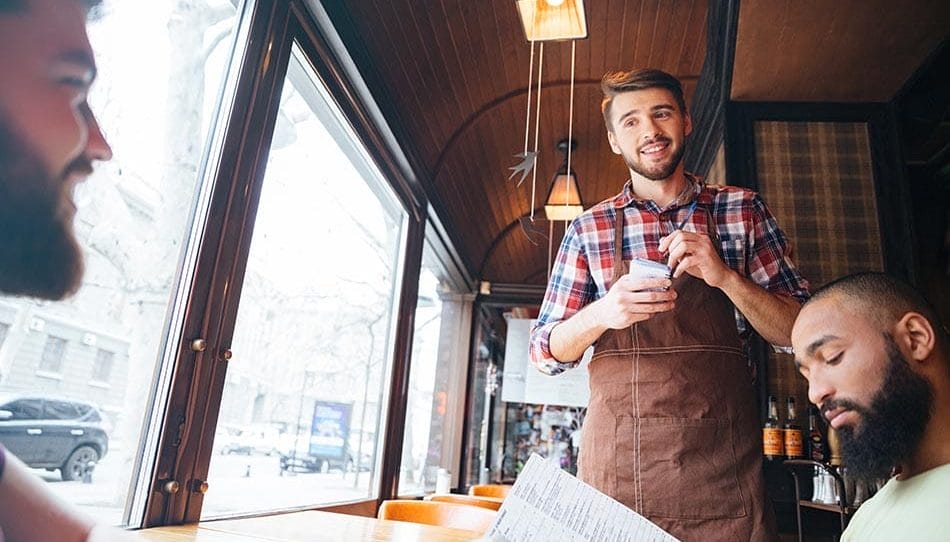 waiter talking to customers