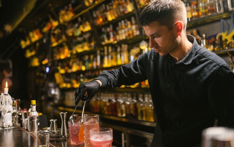 young bartender preparing a drink