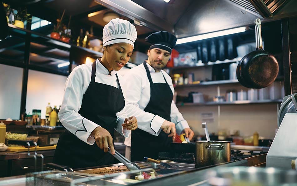 two kitchen staff members