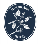 Woodlark Hotel logo