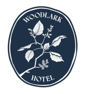 Woodlark Hotel logo