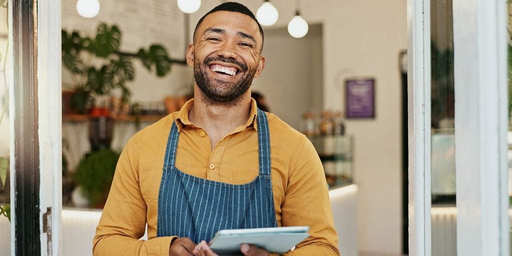 smiling restaurant owner