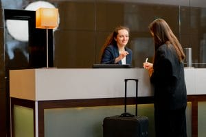 receptionist greeting guest