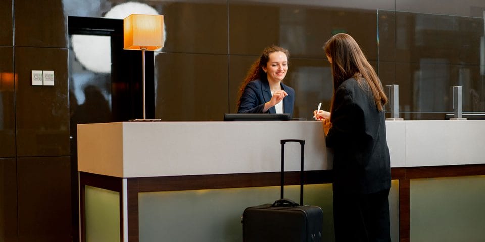 receptionist greeting guest