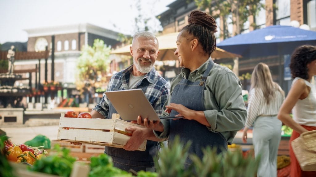 restaurant owner buying vegetables from local farmers