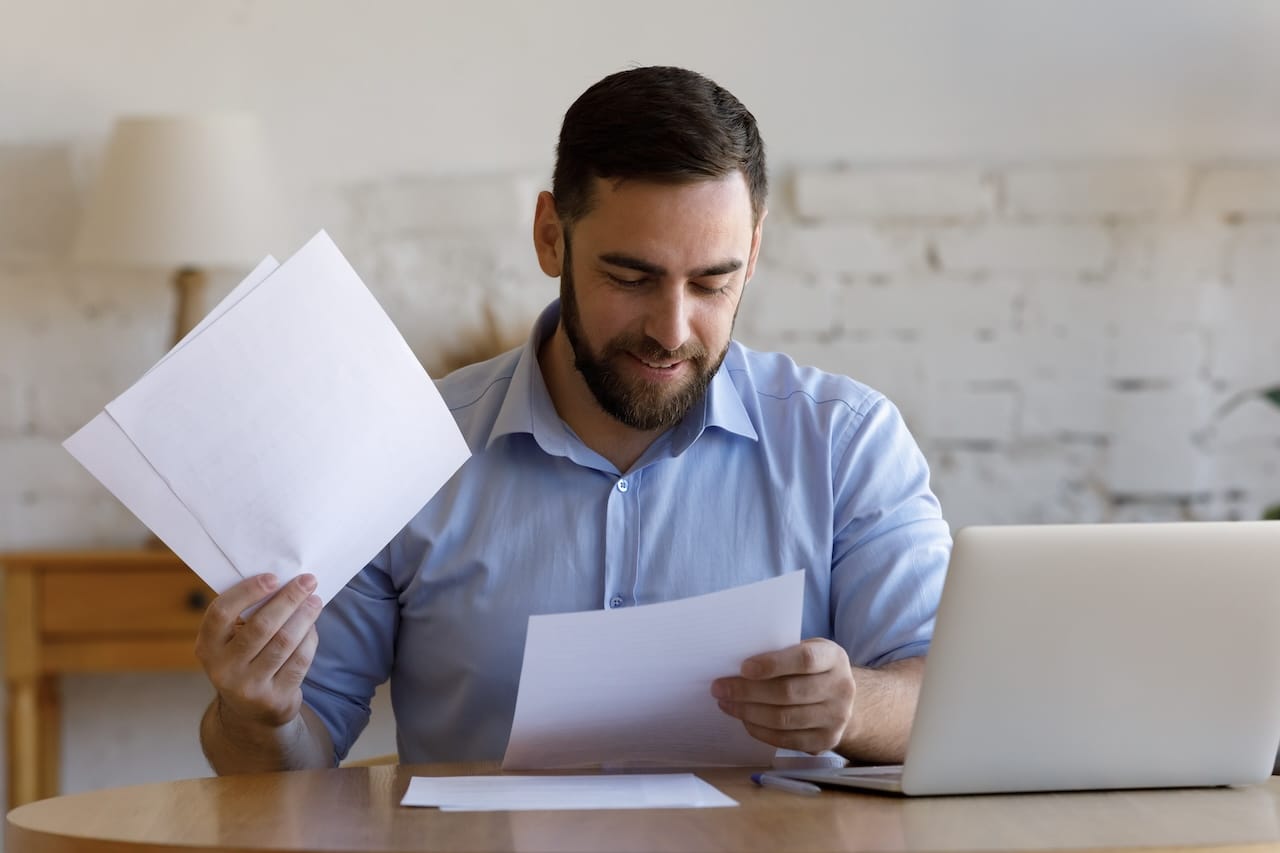 man checking out the health inspection report