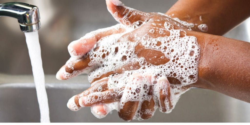 soaped up hands ready to be washed