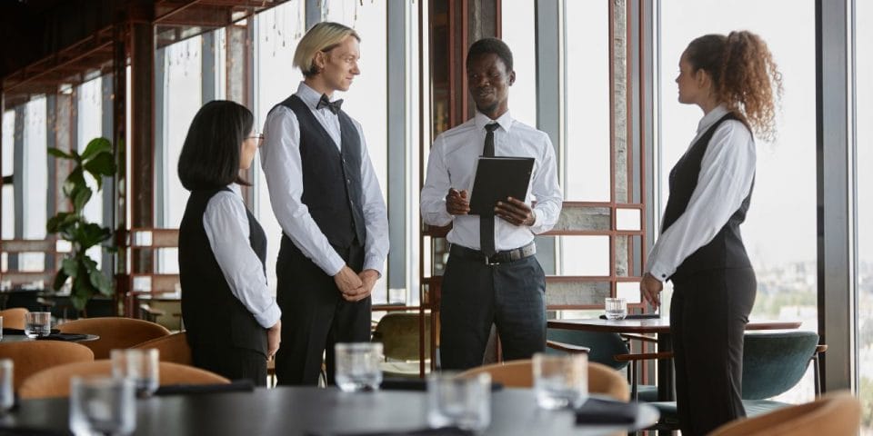 restaurant manager briefing the servers