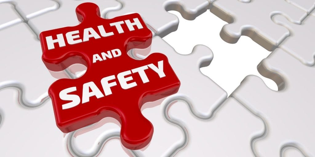 red piece of puzzle with 'health and safety' inscription