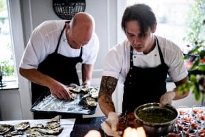 two chefs preparing food