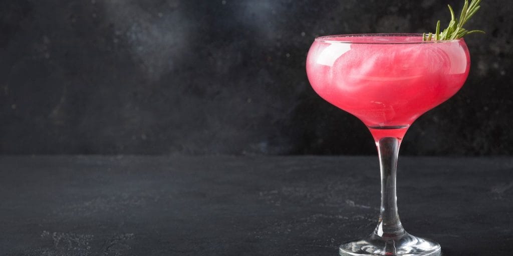 pink cocktail with edible glitter