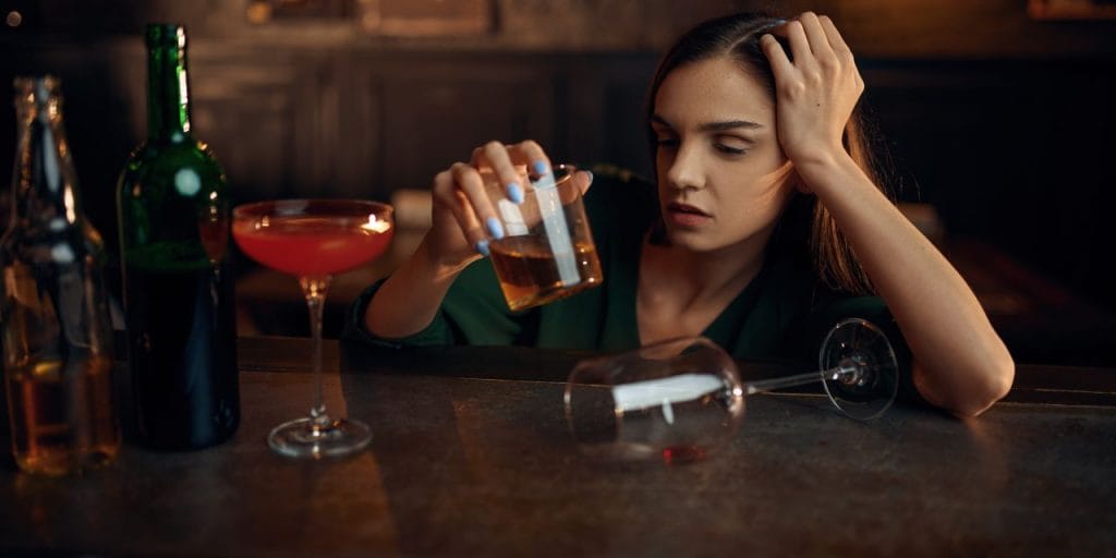 drunk woman at a bar