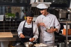 chef and sous chef in kitchen