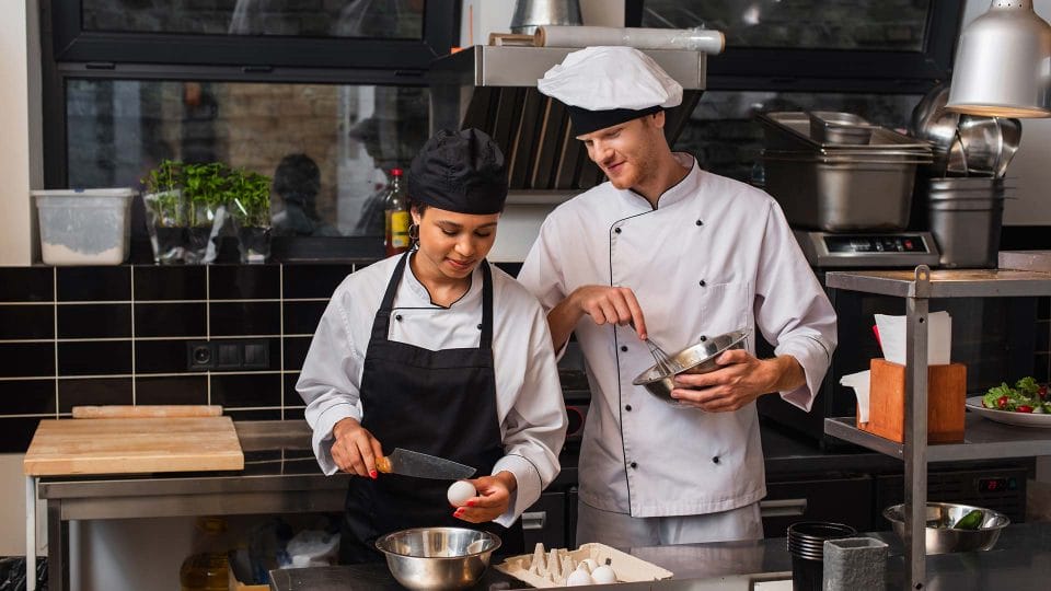 chef and sous chef in kitchen