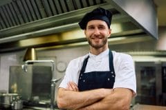 cook posing in kitchen