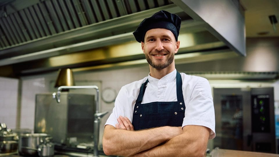 cook posing in kitchen