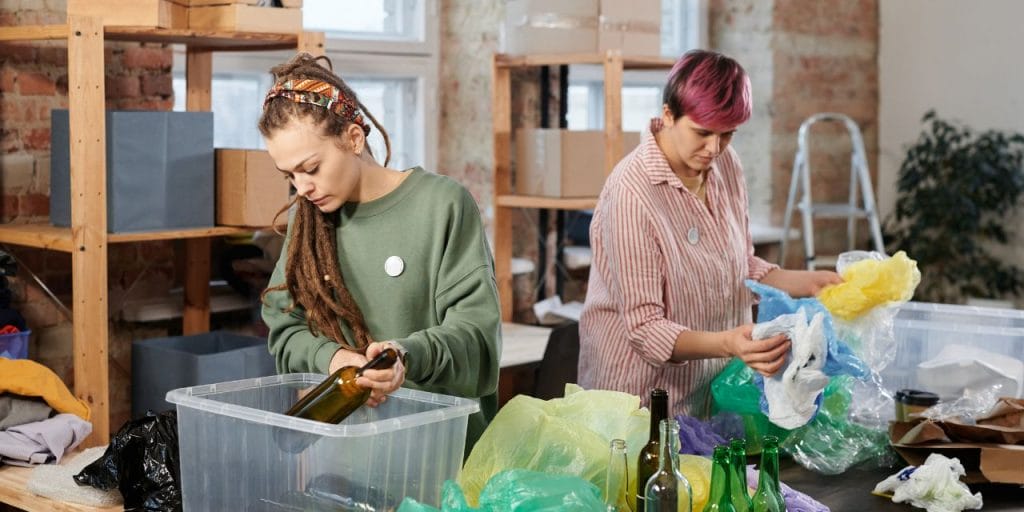 staff sorting out reusable containters