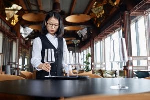 fine dining server setting up table