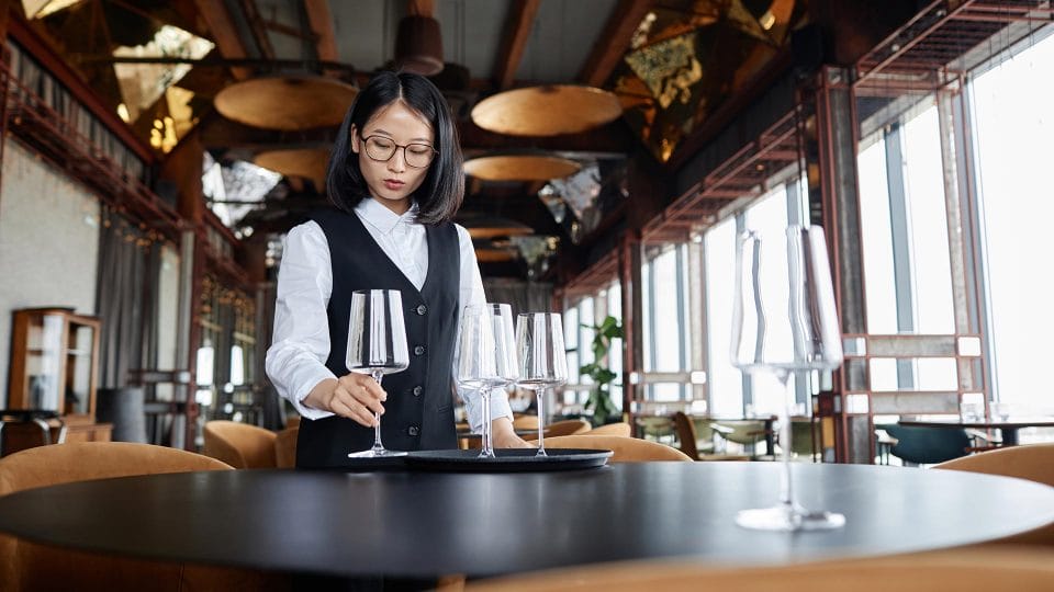 fine dining server setting up table