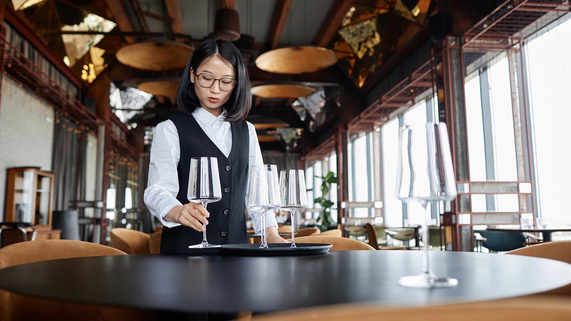 fine dining server setting up table