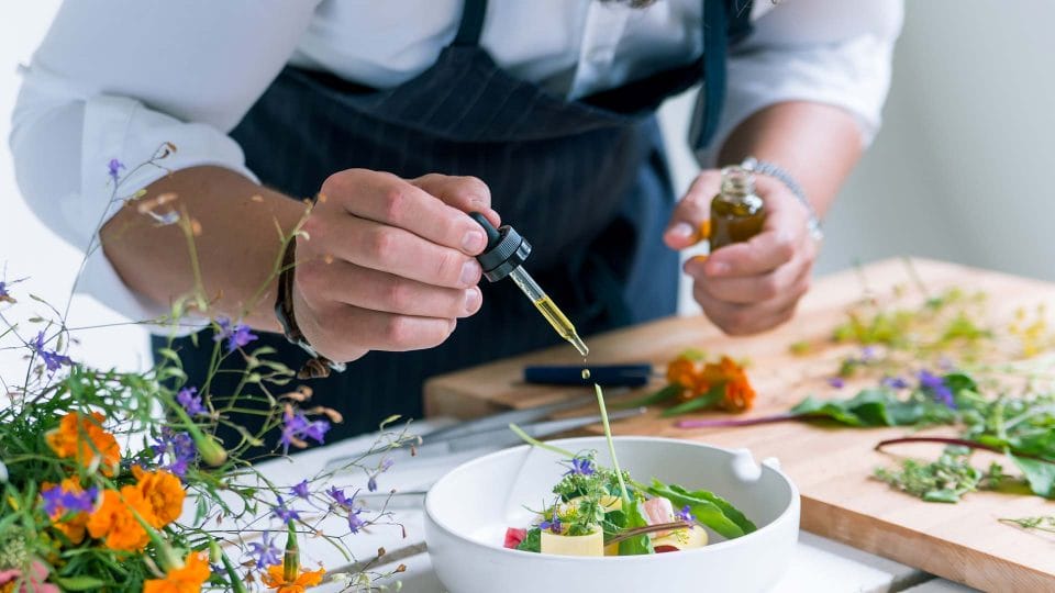 head chef adding finishing touch