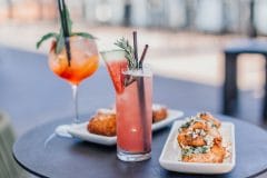 two dishes and two cocktails