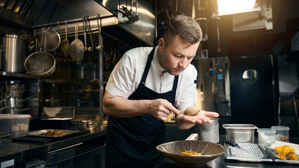 pastry chef preparing elegant desert