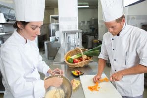 prep cooks chopping vegetables