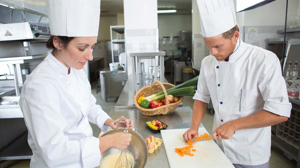 prep cooks chopping vegetables