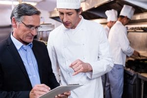 restaurant consultant talking with chef