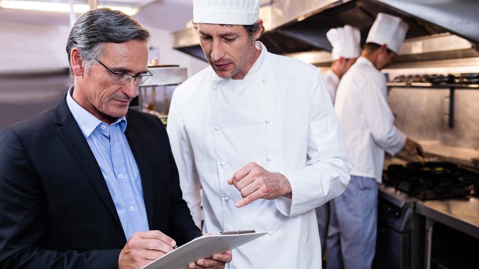 restaurant consultant talking with chef