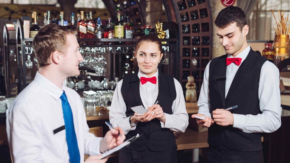 floor manager talking to front of house staff