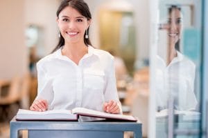 a smiling restaurant hostess