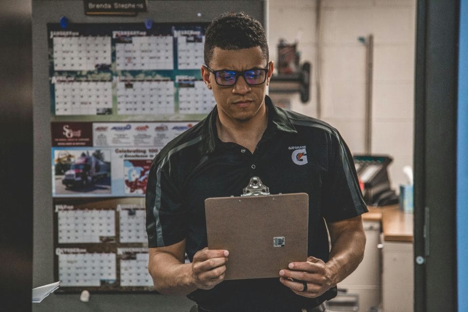 inventory manager looking at cardboard